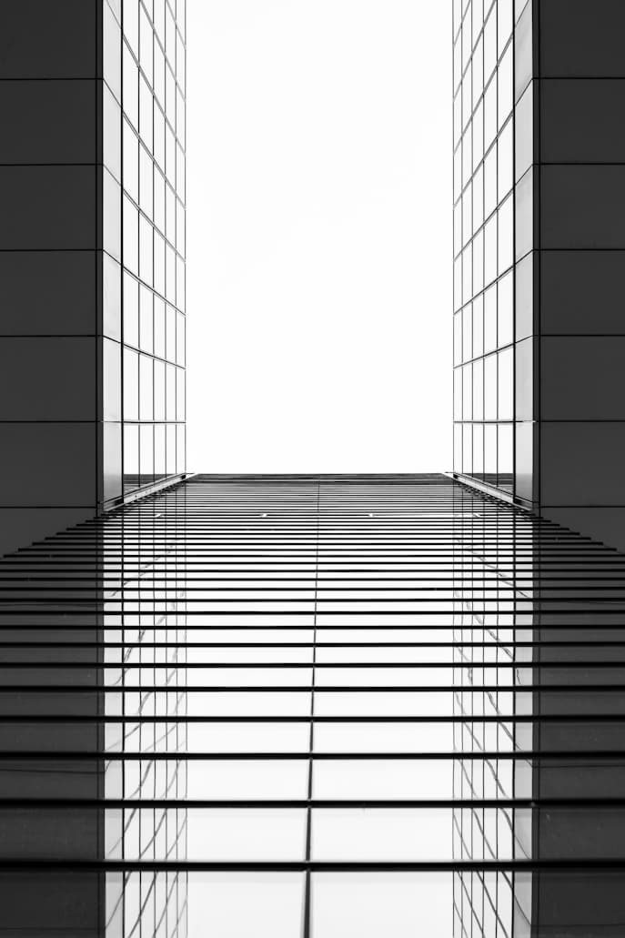 Glass office building facade with reflective windows