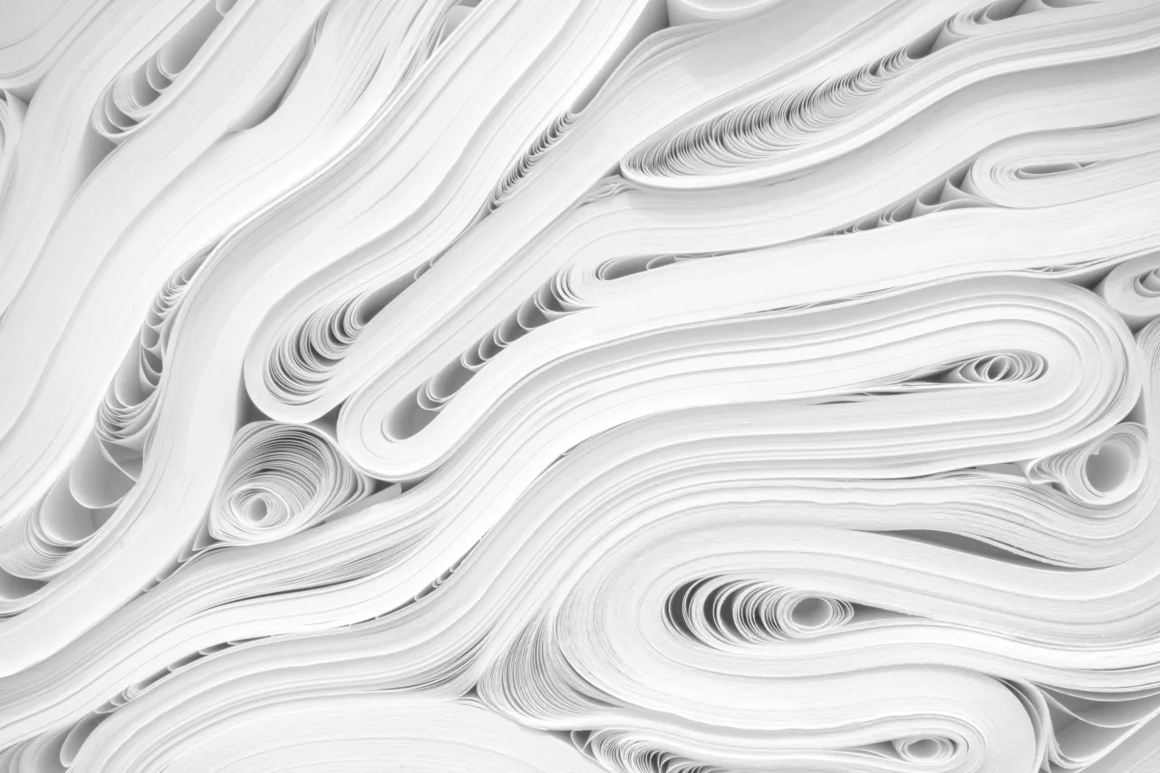 Abstract white layered paper folds with flowing curves
