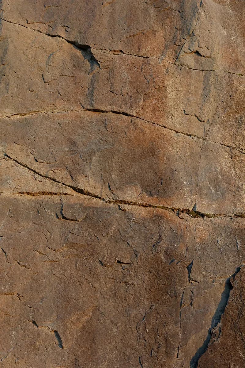 Rock surface with cracks and layered texture