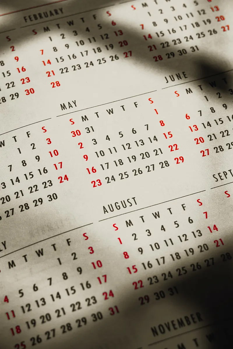 Calendar page showing February through November with dates in black and red weekends