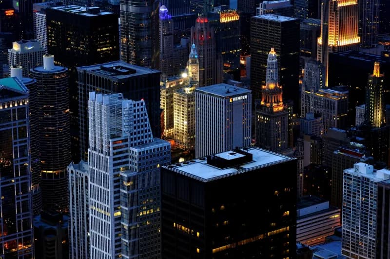 Downtown Chicago skyline at night with illuminated skyscrapers